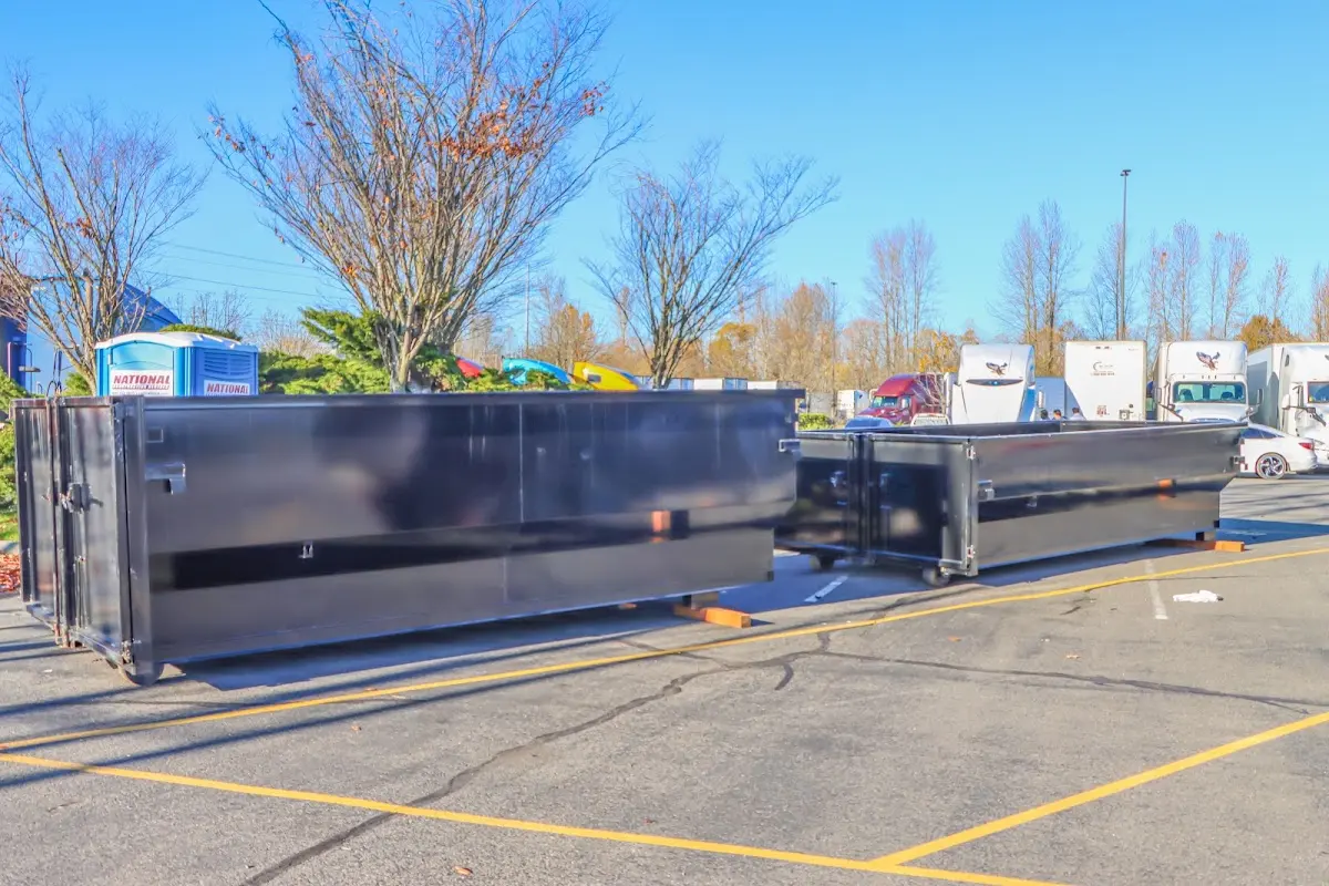 Professional dumpster rental service with roll-off container on residential driveway in Lawndale